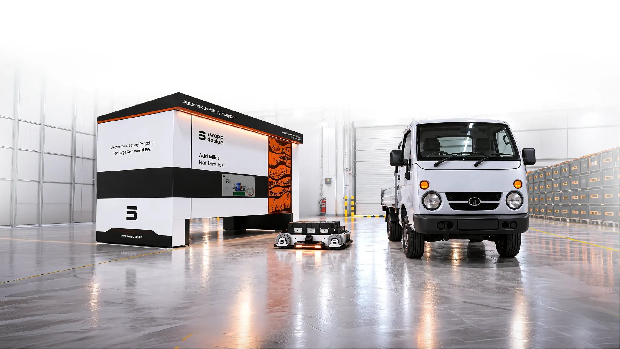 Swapp autonomous battery swapping station, SwappBot and electric commercial vehicle in a bright industrial facility